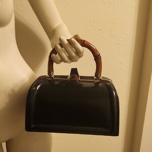 Elegant Black Handbag with Brown Handle